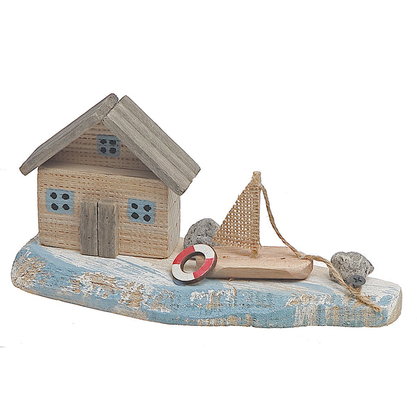 Wooden House & Sail Boat By The Sea Shore