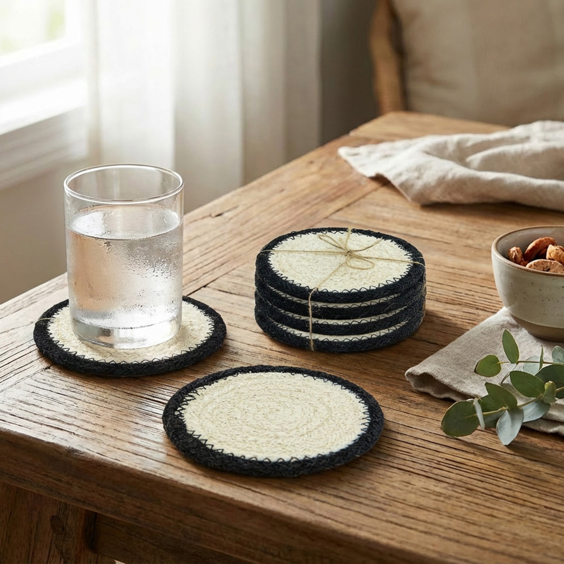 Set of 4 Round Jute Coasters in Classic White and Black for Versatile Table Settings