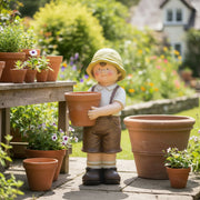 Magnesia Garden Boy Figurine Holding Planter