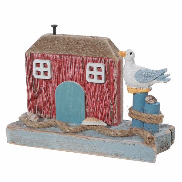 Wooden House With Bird By The Seashore